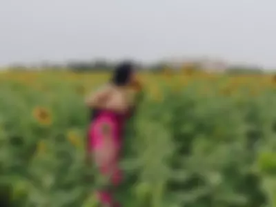 sexy and happy girl in a field of sunflowers by LiluGrants