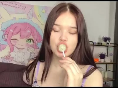 Sucking on a lollipop by rinna-jensen